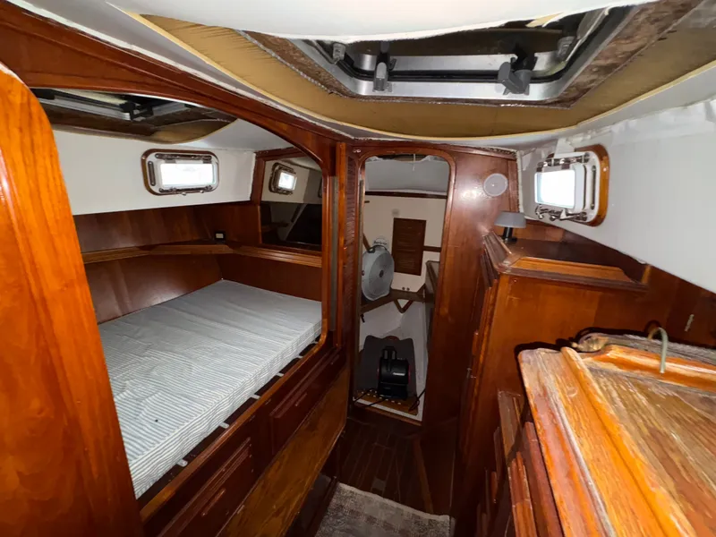 Slide: The Image of Interior of a 1977 Islander Yachts Freeport 36 with wooden furnishings. - 7