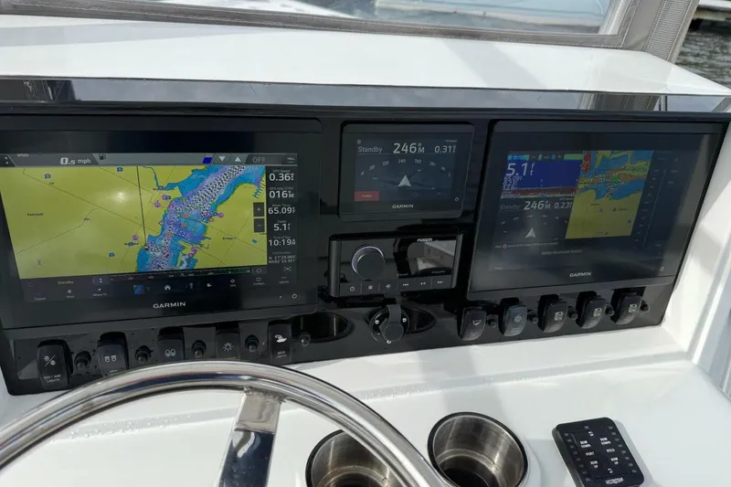Slide: The Image of Dashboard of 2023 T Craft 27 boat with Garmin navigation displays. - 17