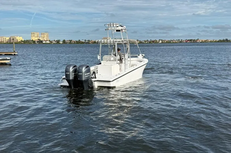 Slide: The Image of 2023 T Craft 27 boat with dual Yamaha engines on open water. - 21