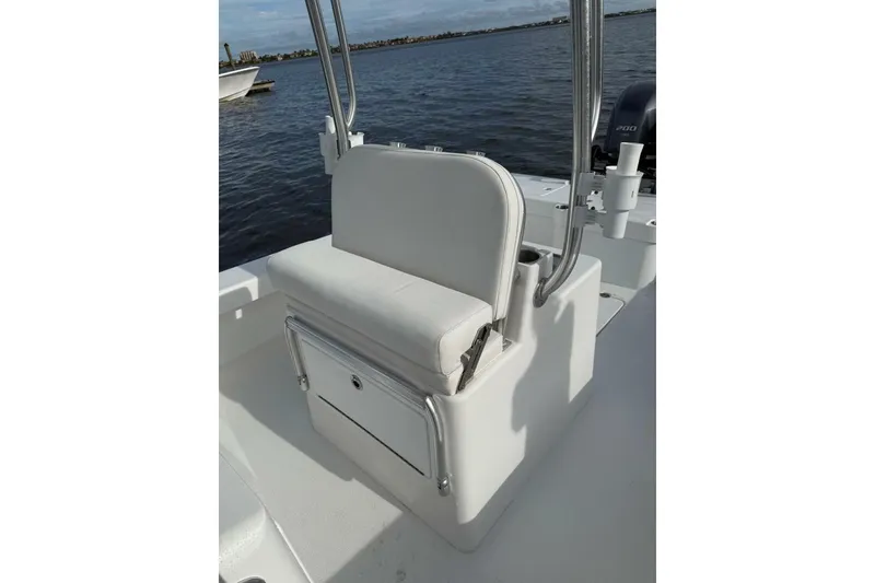 Slide: The Image of 2023 T Craft 27 boat seat with storage, on calm water background. - 4