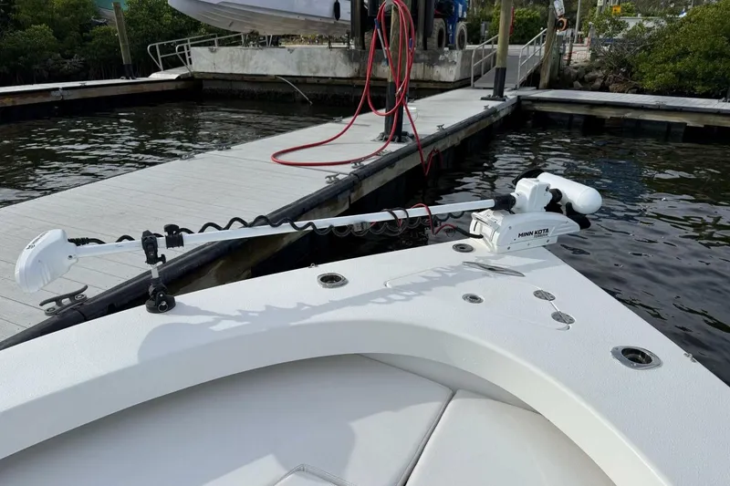 Slide: The Image of 2023 T Craft 27 boat with Minn Kota trolling motor at dockside. - 7