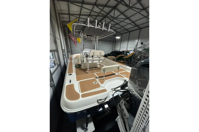 Slide: The Image of 2011 Hydra-Sports Bay Bolt 23 boat in storage, featuring spacious deck and modern design. - 11