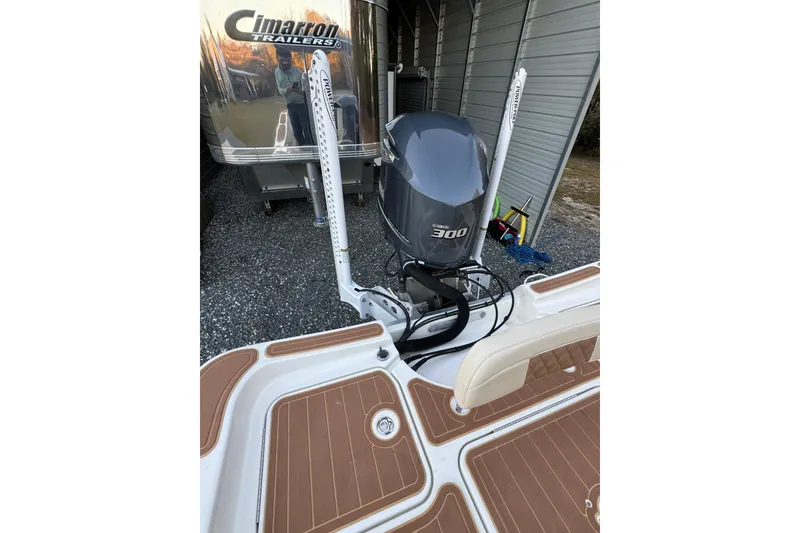 Slide: The Image of 2011 Hydra-Sports Bay Bolt 23 with Yamaha 300 engine, parked near Cimarron trailer. - 21