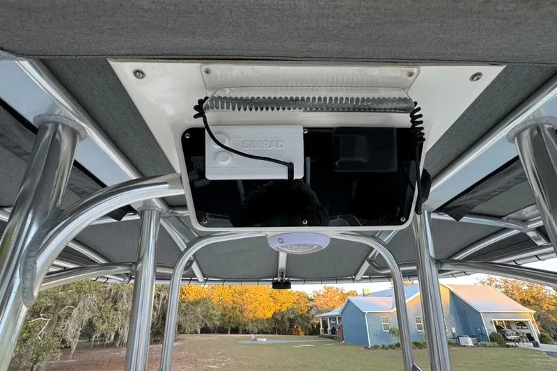 Slide: The Image of 2011 Hydra-Sports Bay Bolt 23 boat with Simrad electronics under T-top canopy. - 24