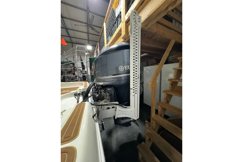 Slide: The Image of 2011 Hydra-Sports Bay Bolt 23 boat with Yamaha outboard motor in storage. - 25