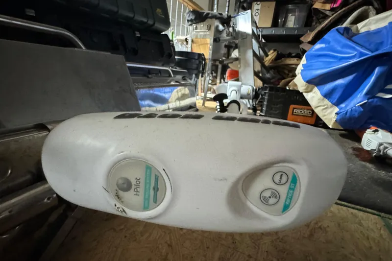 Slide: The Image of 2011 Hydra-Sports Bay Bolt 23 boat equipment in a cluttered storage area. - 27