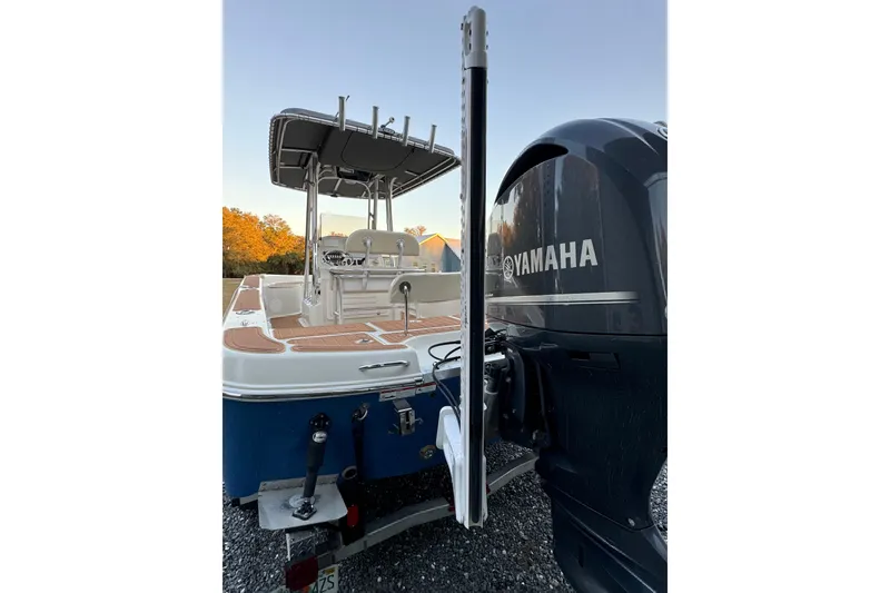 Slide: The Image of 2011 Hydra-Sports Bay Bolt 23 boat with Yamaha engine, parked on gravel. - 7