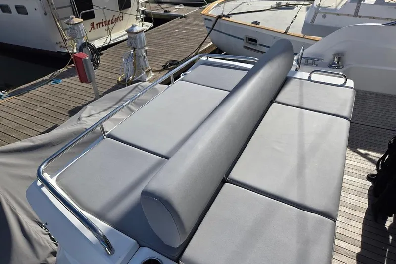 Slide: The Image of Sunseeker Predator 50 yacht's sunbed area, 2019 model, docked at marina. - 11