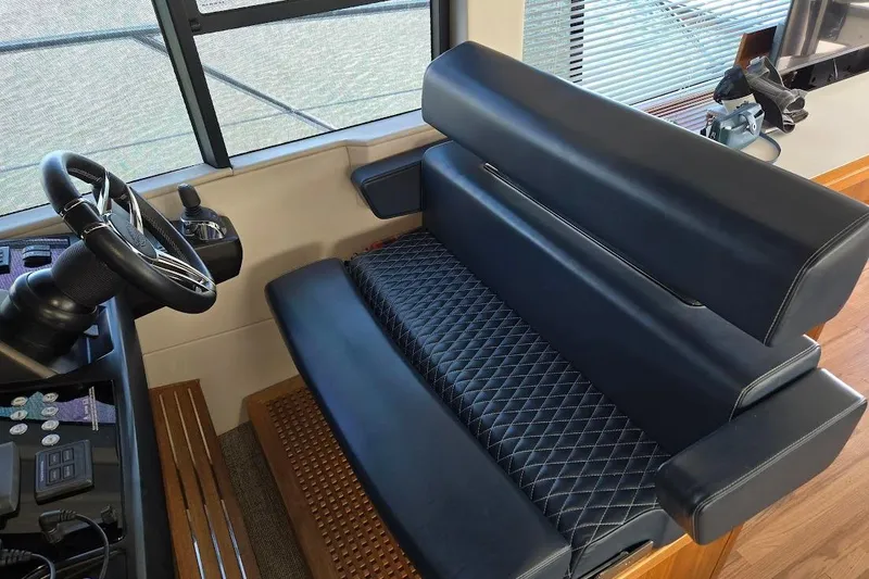 Slide: The Image of Luxurious interior of 2019 Sunseeker Predator 50 yacht with leather seating and steering wheel. - 14