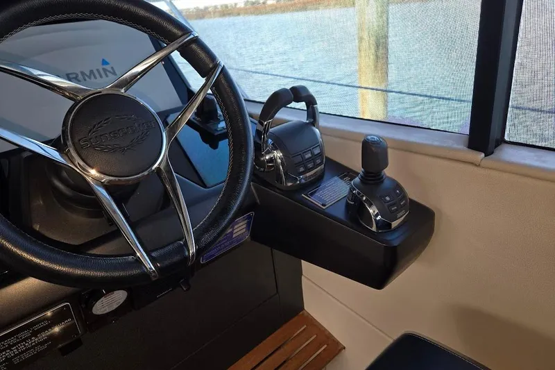 Slide: The Image of Steering wheel and controls of 2019 Sunseeker Predator 50 yacht cockpit. - 15