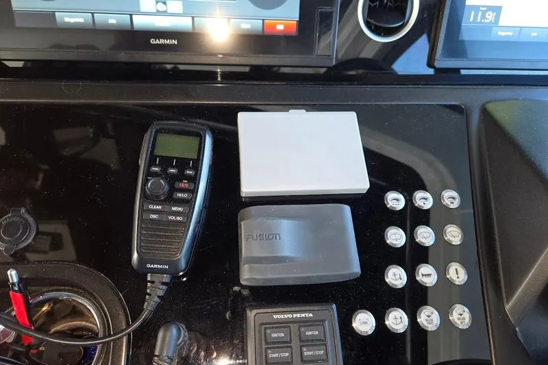 Slide: The Image of Control panel of 2019 Sunseeker Predator 50 yacht with Garmin and Fusion devices. - 22