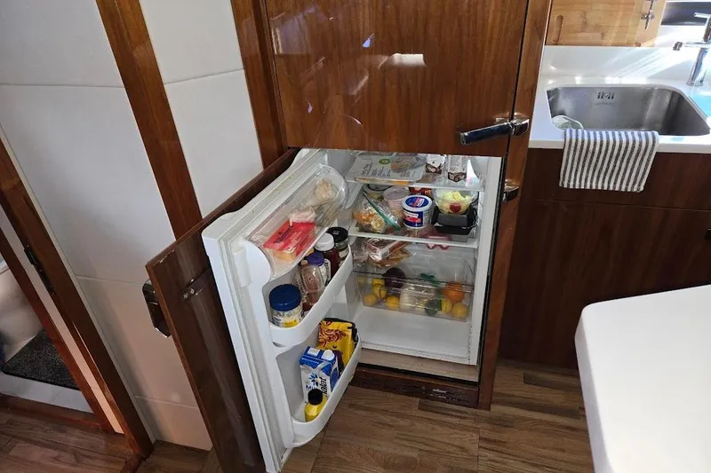 Slide: The Image of Luxurious kitchen interior of 2019 Sunseeker Predator 50 yacht with modern appliances. - 30