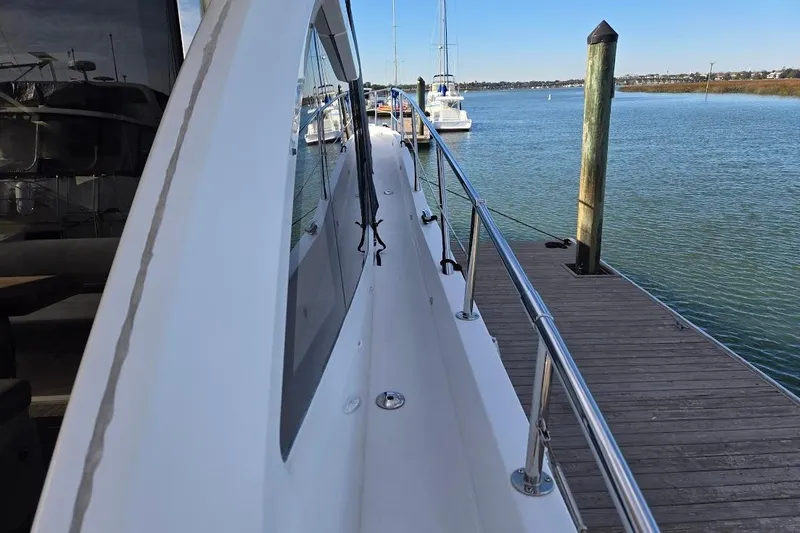 Slide: The Image of Sunseeker Predator 50 yacht's sunbed, 2019 model, docked at marina. - 59