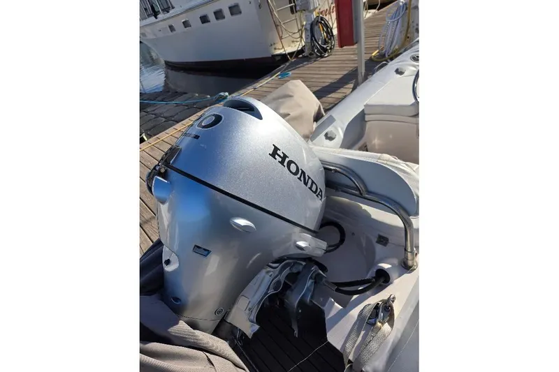 Slide: The Image of Sunseeker Predator 50 yacht 2019, featuring a spacious gray cushioned seating area. - 61