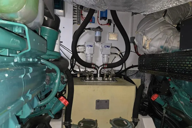 Slide: The Image of Engine room of 2019 Sunseeker Predator 50 yacht, featuring pipes, ladder, and control panels. - 67