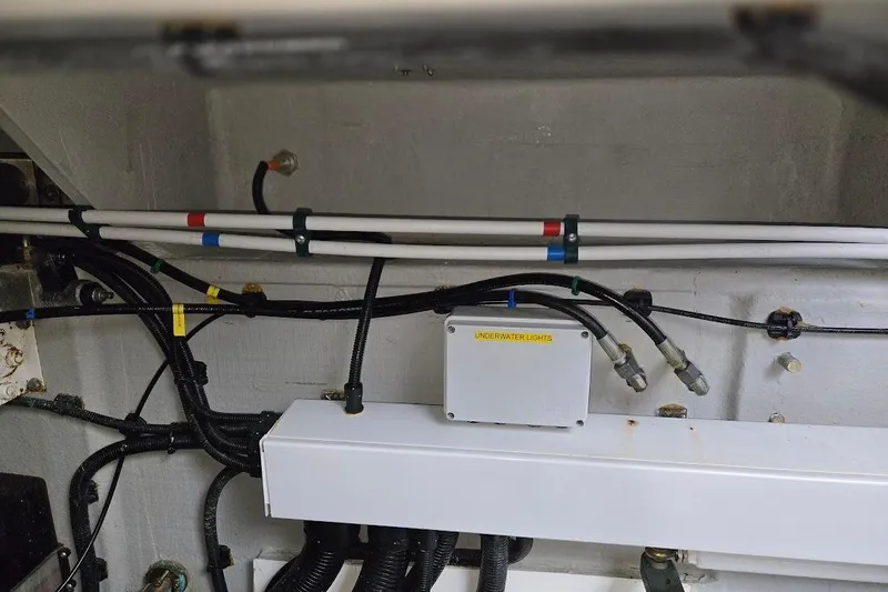 Slide: The Image of Engine compartment of 2019 Sunseeker Predator 50 yacht with visible wiring and components. - 78