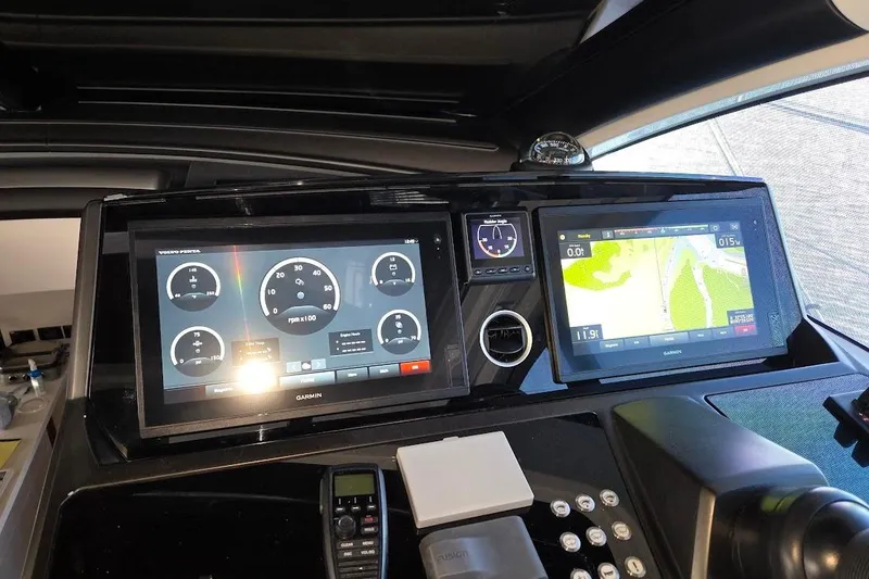 Slide: The Image of 2019 Sunseeker Predator 50 yacht dashboard with Garmin navigation displays. - 8