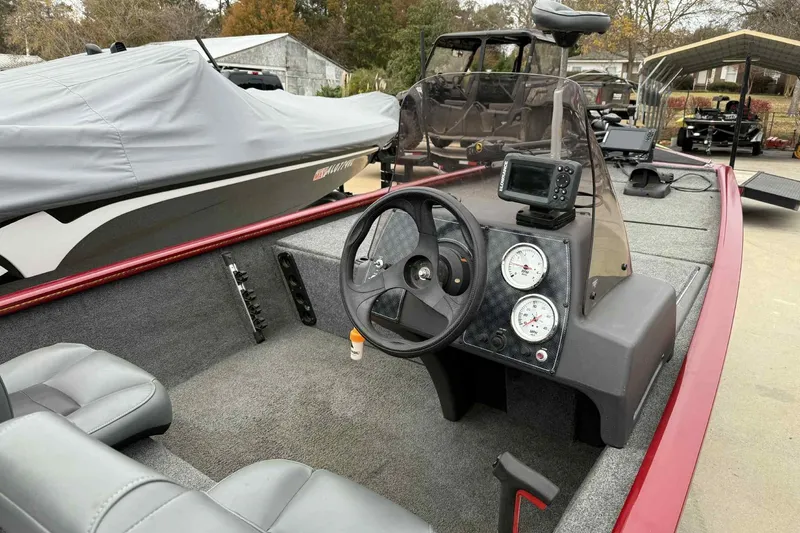 Slide: The Image of 2020 Bass Tracker PT 160 boat interior with steering wheel and gauges. - 5