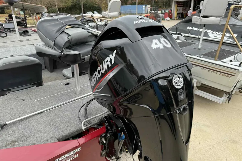 Slide: The Image of 2020 Bass Tracker PT 160 boat with Mercury 40 outboard motor, parked outdoors. - 7