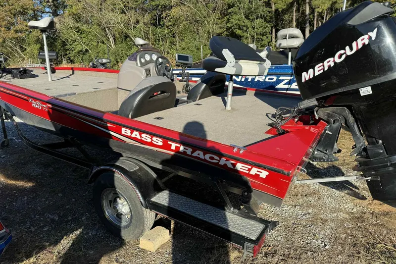 Slide: The Image of 2006 Bass Tracker PT190 boat with Mercury engine, parked outdoors. - 3