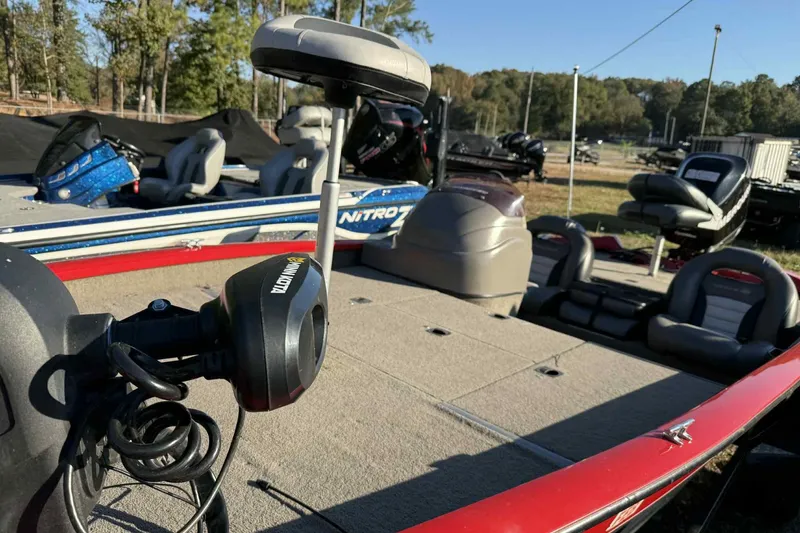 Slide: The Image of 2006 Bass Tracker PT190 boat with Minn Kota trolling motor, spacious deck, and seating. - 8