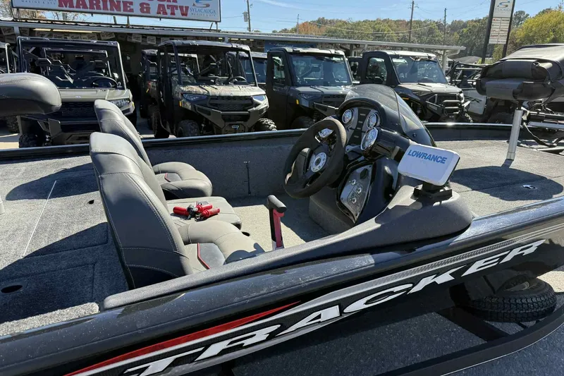 Slide: The Image of 2021 Bass Tracker 190 PT boat interior with steering console and seating. - 6