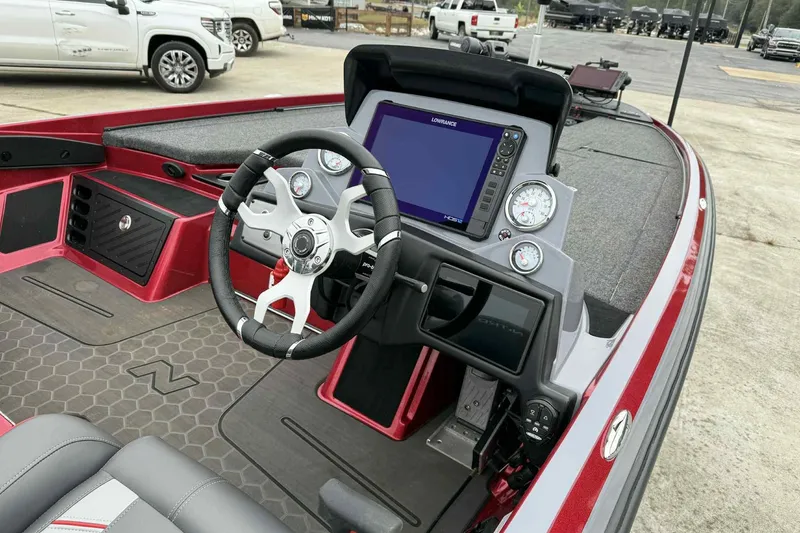 Slide: The Image of 2024 Nitro Z21 XL boat interior with steering wheel and digital display. - 4