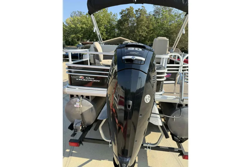 Slide: The Image of 2023 Sun Tracker SportFish 20 DLX pontoon boat with Mercury outboard motor. - 5