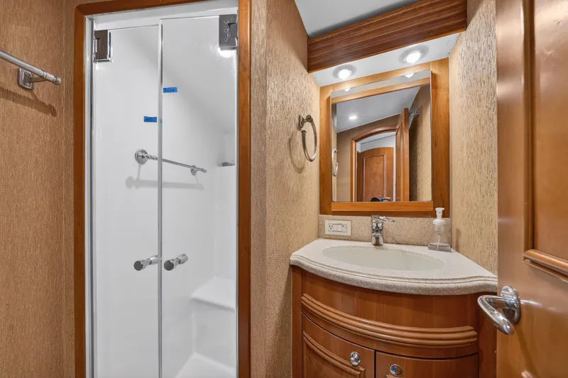 Slide: The Image of Luxurious bathroom on 2004 B&D 65 Flybridge yacht with shower and vanity. - 41