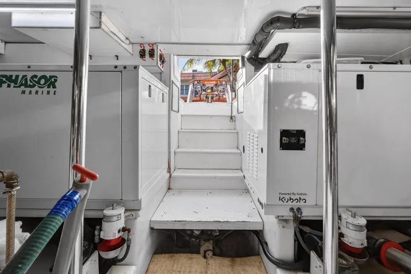 Slide: The Image of Engine room of 2004 B&D 65 Flybridge yacht with Kubota generator and Phasor Marine equipment. - 52