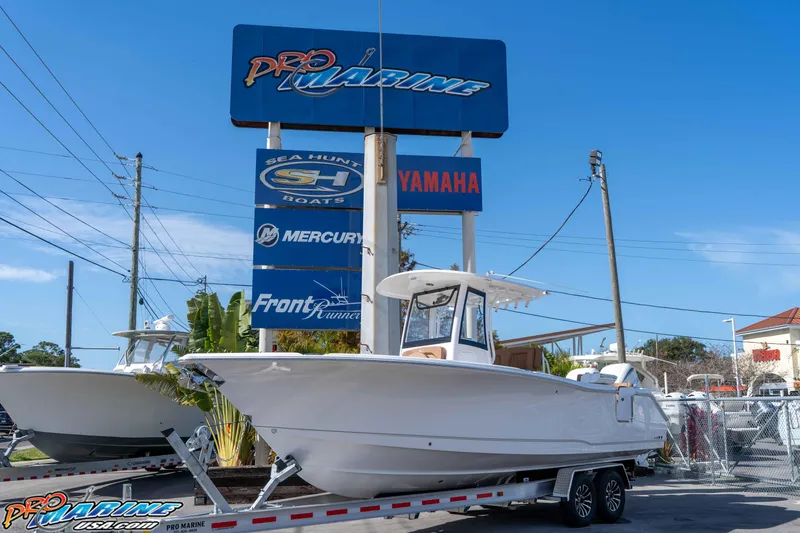 The Image of 2026 Sea Hunt Ultra 275 SE boat on trailer at Pro Marine dealership. - 0
