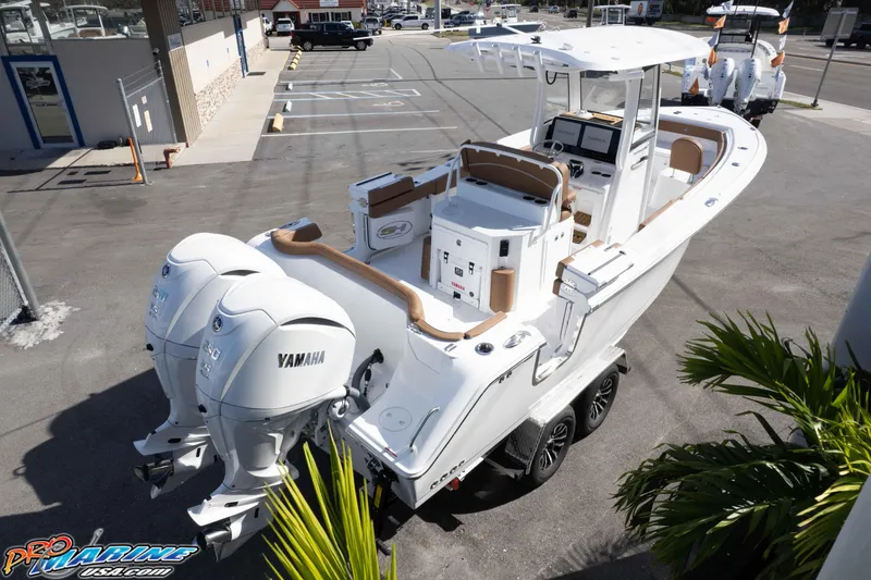 Slide: The Image of 2026 Sea Hunt Ultra 275 SE boat with dual Yamaha engines on a trailer. - 13