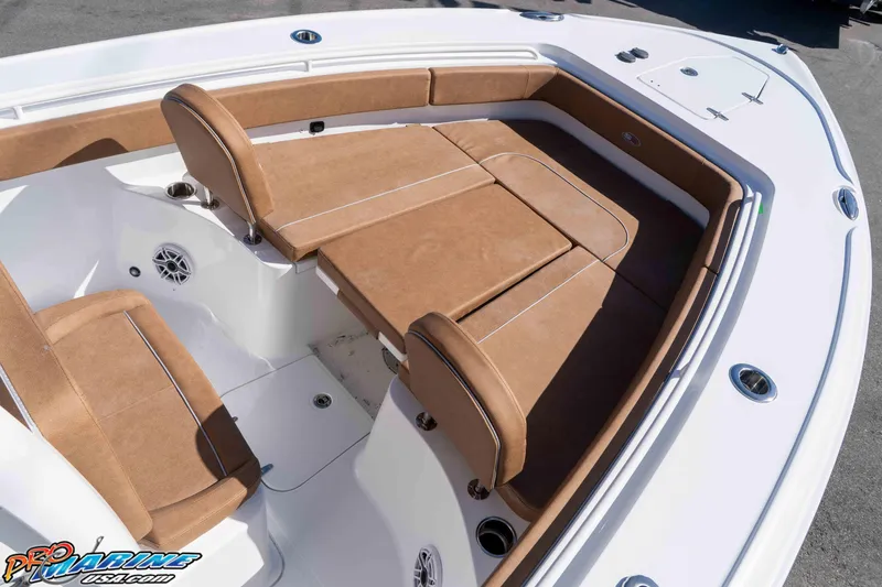 Slide: The Image of 2026 Sea Hunt Ultra 275 SE boat with tan cushioned seating and white deck. - 20