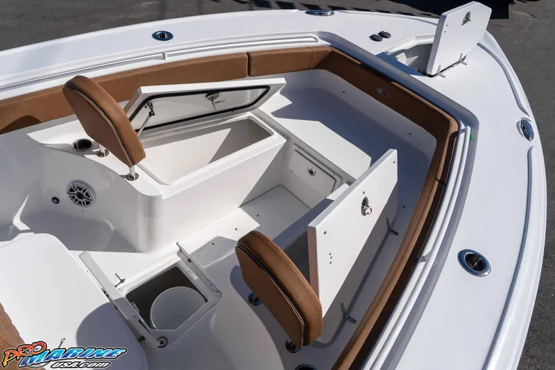 Slide: The Image of 2026 Sea Hunt Ultra 275 SE boat interior with open storage compartments and seating. - 22