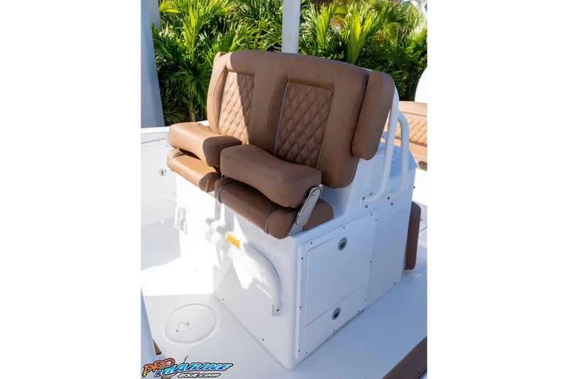 Slide: The Image of 2026 Sea Hunt Ultra 275 SE boat with luxurious brown seating and white deck. - 31