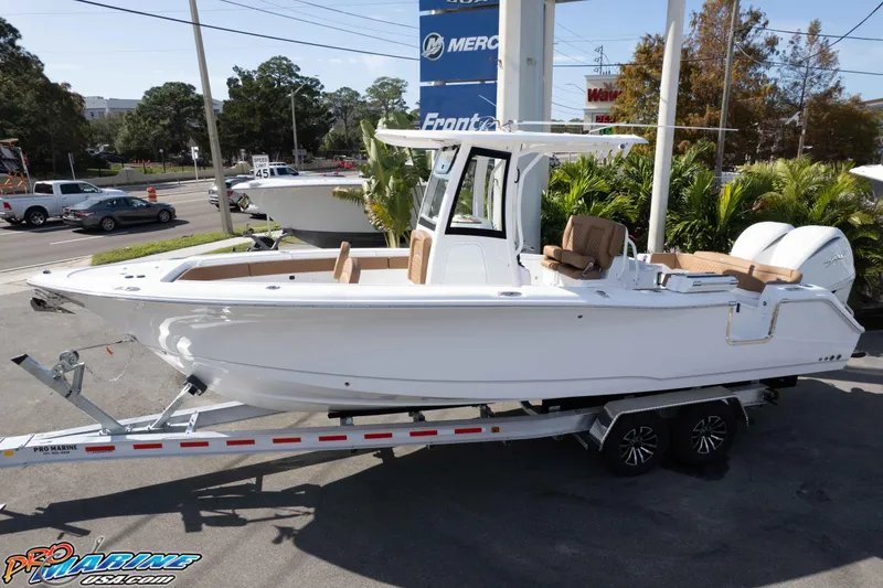 Slide: The Image of 2026 Sea Hunt Ultra 275 SE boat on trailer, displayed outdoors. - 9