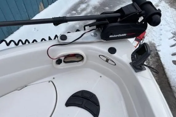 Slide: The Image of 2008 Tahoe Q5i SF boat with trolling motor and fish finder on snowy dock. - 12
