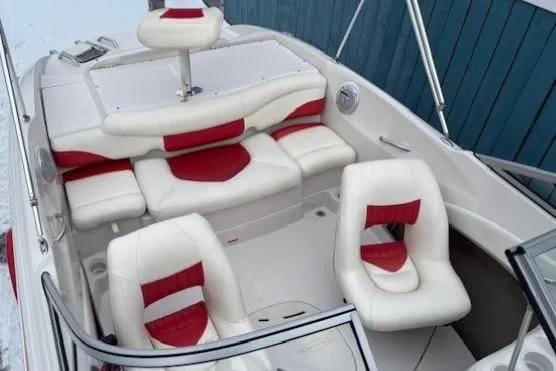Slide: The Image of 2008 Tahoe Q5i SF boat interior with white and red seating, modern design. - 14