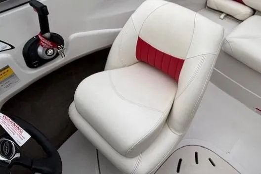 Slide: The Image of 2008 Tahoe Q5i SF boat interior with white and red seating and control panel. - 16