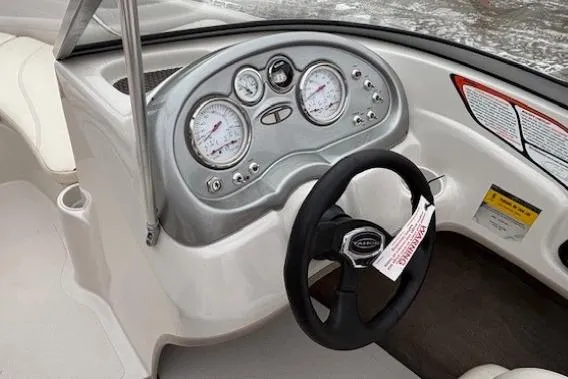 Slide: The Image of 2008 Tahoe Q5i SF boat dashboard with steering wheel and gauges. - 17
