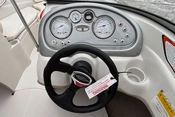 Slide: The Image of 2008 Tahoe Q5i SF boat dashboard with steering wheel and instrument panel. - 18