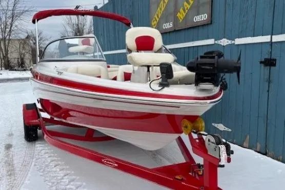 Slide: The Image of 2008 Tahoe Q5i SF boat in red and white on a snowy day. - 2