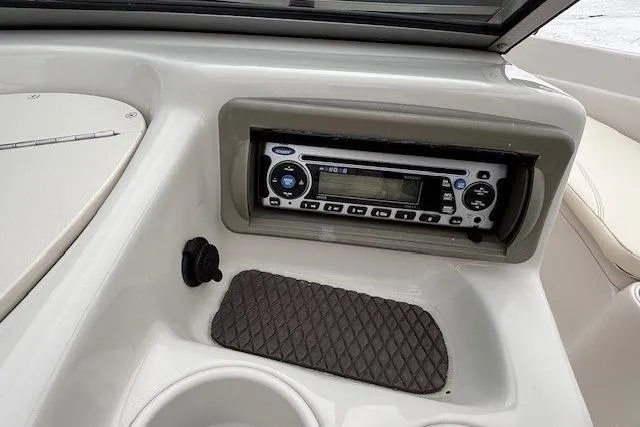 Slide: The Image of 2008 Tahoe Q5i SF boat dashboard with stereo system and cup holders. - 21
