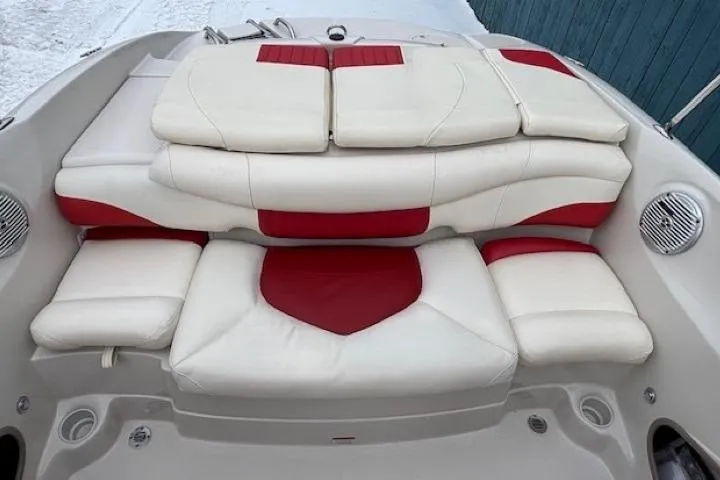 Slide: The Image of 2008 Tahoe Q5i SF boat interior with white and red cushioned seating. - 23