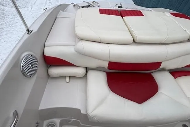 Slide: The Image of 2008 Tahoe Q5i SF boat interior with red and white cushioned seating. - 24