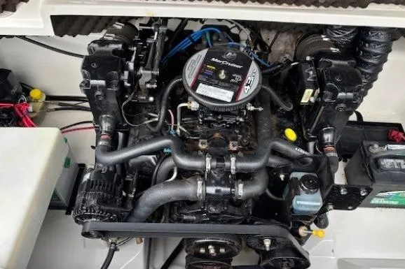 Slide: The Image of Engine compartment of a 2008 Tahoe Q5i SF boat, showcasing mechanical components and wiring. - 27