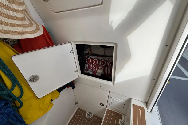 Slide: The Image of 2009 Venture 39 Center Console interior with open hatch and visible wiring. - 19