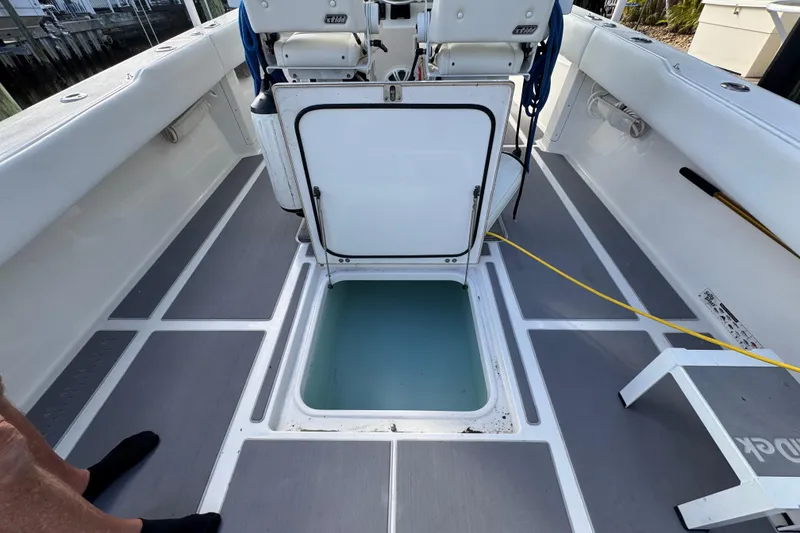 Slide: The Image of 2009 Venture 39 Center Console boat with open hatch and seating area. - 26