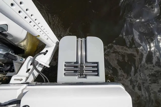 Slide: The Image of 2024 Islamorada Boatworks 24, rear deck view, featuring sleek design and water reflection. - 12