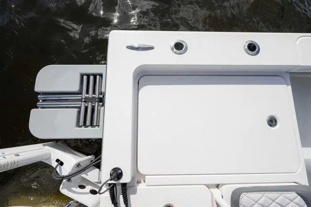 Slide: The Image of 2024 Islamorada Boatworks 24, featuring a sleek deck design and integrated ladder. - 13